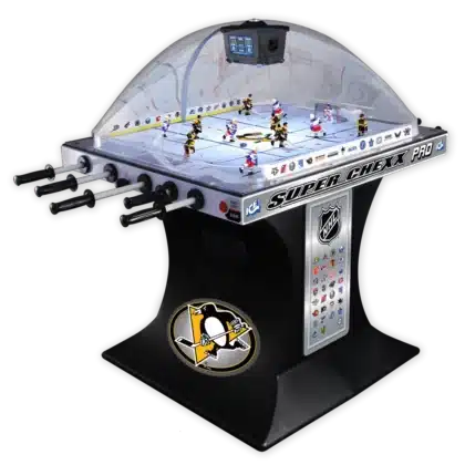 Bubble hockey arcade table with players under a clear dome; Penguins logo on the base and league insignia around the playfield.