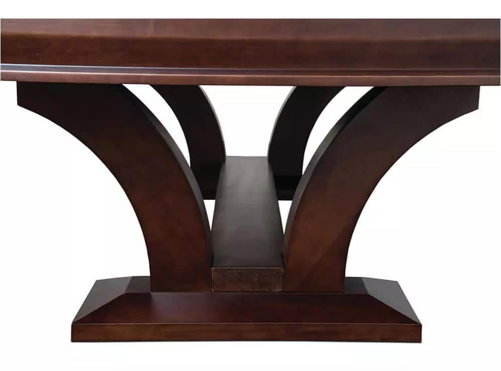 Dark wood dining table base with two curved arches forming supports and a central beam on a rectangular plinth.