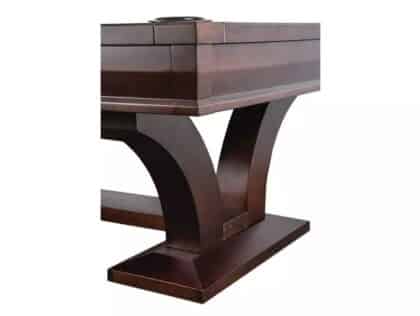 Dark wooden piano with thick curved legs resting on a rectangular base, shown from a side angle.
