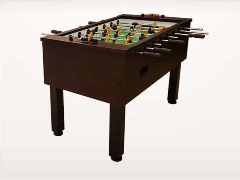 Foosball table with a dark wooden finish, players in yellow and black, shown from a slight angle against a light background.