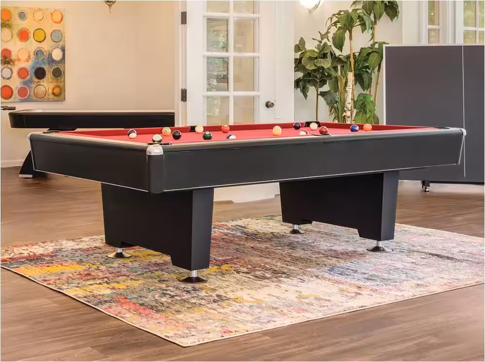 Black-Diamond-room-setting-comp-600x450 | Black 7ft or 8ft Diamond Billiards Table | West Penn Billiards Modern billiards pool table with red felt and scattered balls in a bright living room.