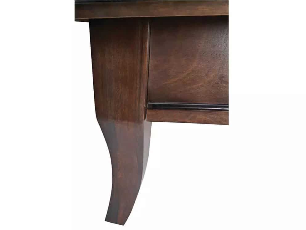 Close-up of a dark wood table or desk leg with a curved cabriole shape attached to a drawer unit.