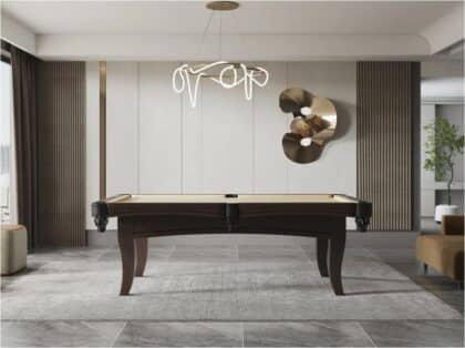 Dark wooden pool table in a luxe living space with sculptural wall art, neutral tones and a modern chandelier above.