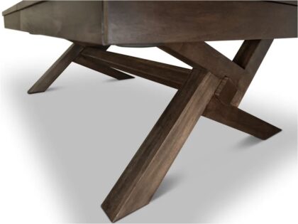 Close-up of a rustic wooden table base with intersecting angled legs.