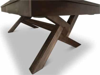 Dark wood table with cross‑shaped (X) trestle legs, viewed from a low angle against a white background, showcasing the sturdy base.