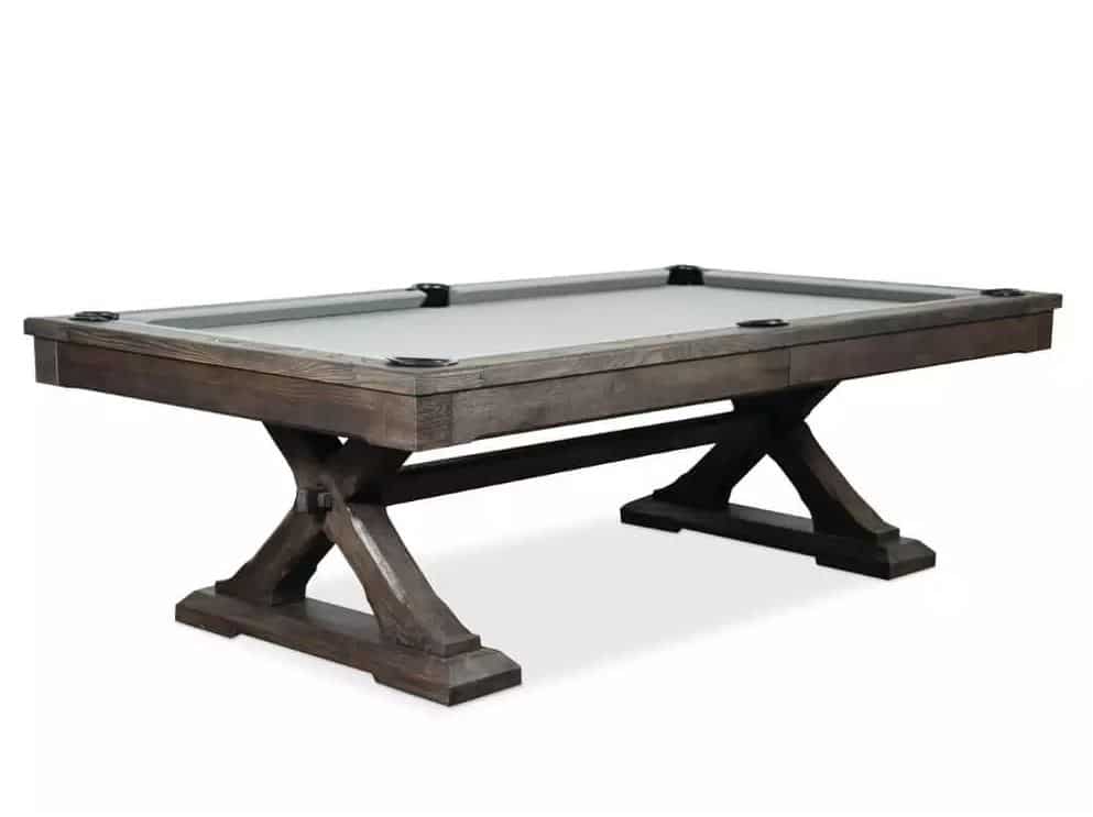 Pool table with gray felt and dark wooden frame on X-shaped legs, set on a white background.